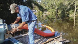 Hurricane-pumps_1-768x432 District staff member setting up a water pump in Hawthorne
