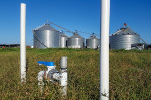 Pipes and shut off valve in a farm field