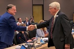 The St. Johns River Water Management District Governing Board today appointed Mike Register (left) as Executive Director. Here he is congratulated by Governing Board Chairman Gen. Douglas Burnett.