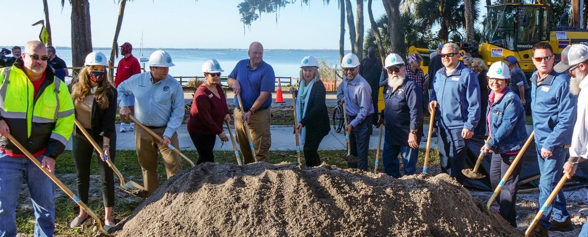The District’s Clay Coarsey (middle) and partners participate in a groundbreaking ceremony