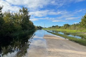 water over a gravel road