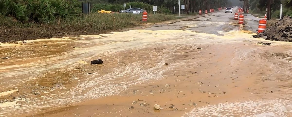 Sand washed over a road