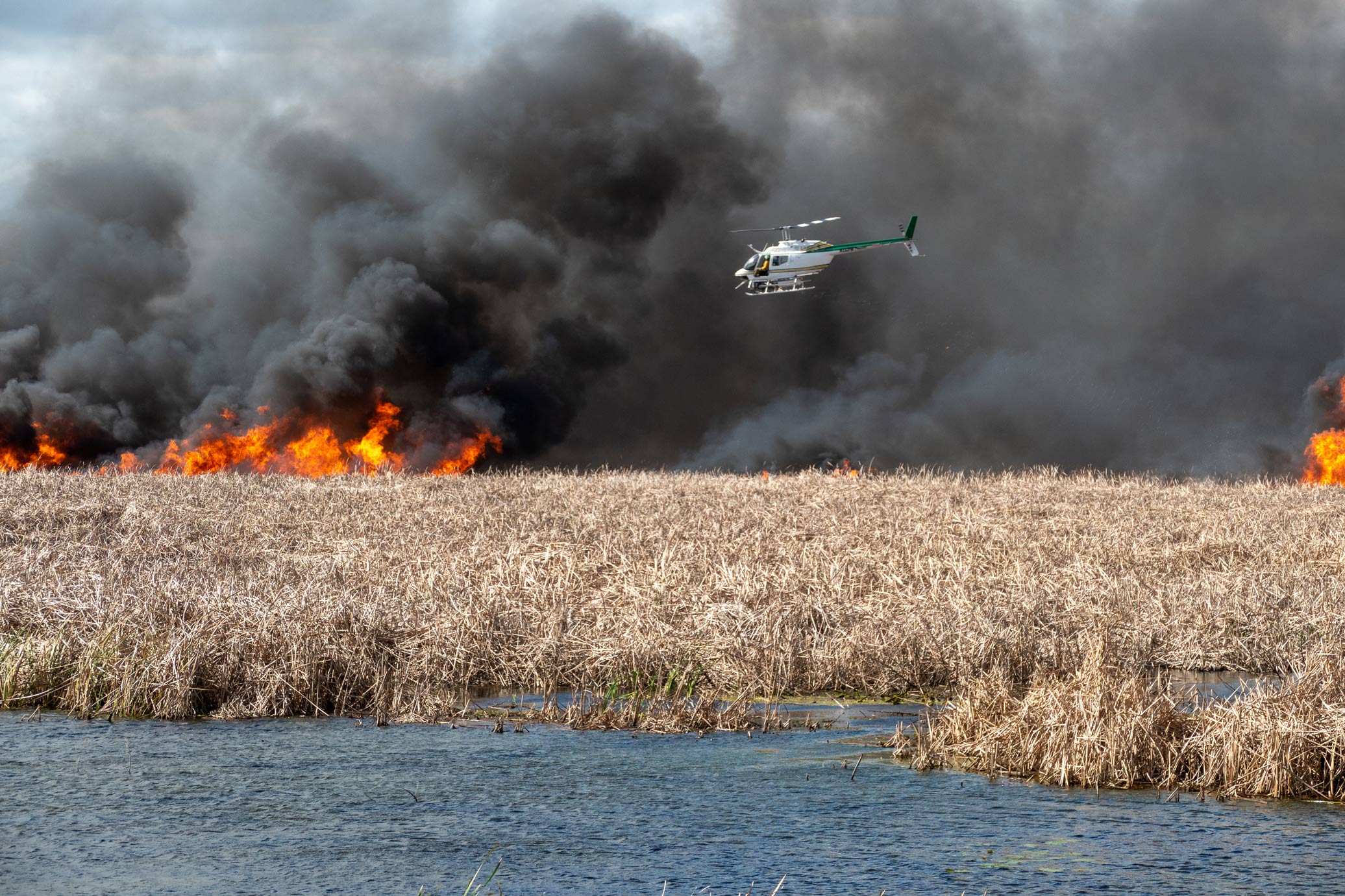 Helicopter flying by a fire