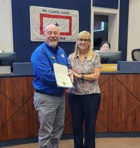 Mayor Catherine Robinson and Bill White holding a proclamation