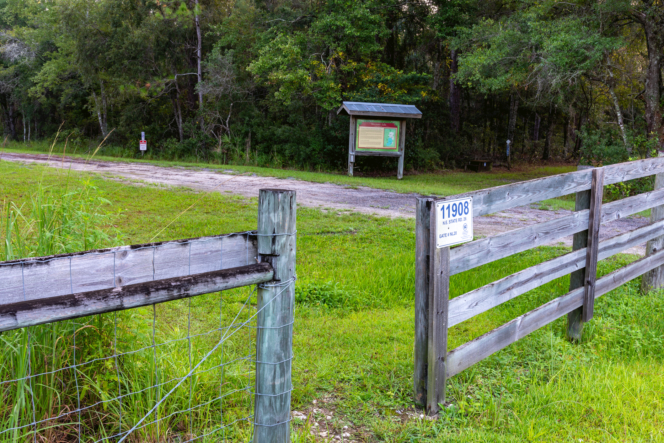 Opening in the fence to Newnans Lake Conservation Are