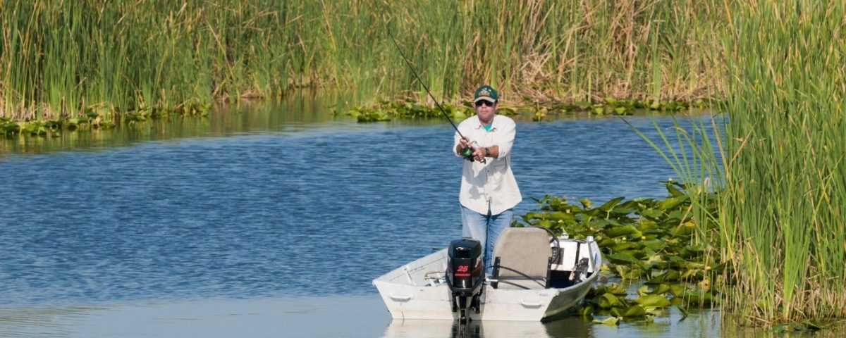 Fisherman fishing in a river