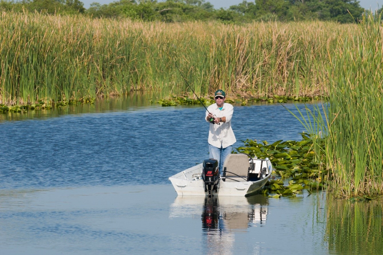 Fisherman fishing in a river