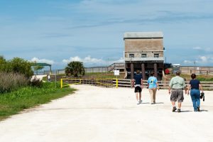 People walking towards a building
