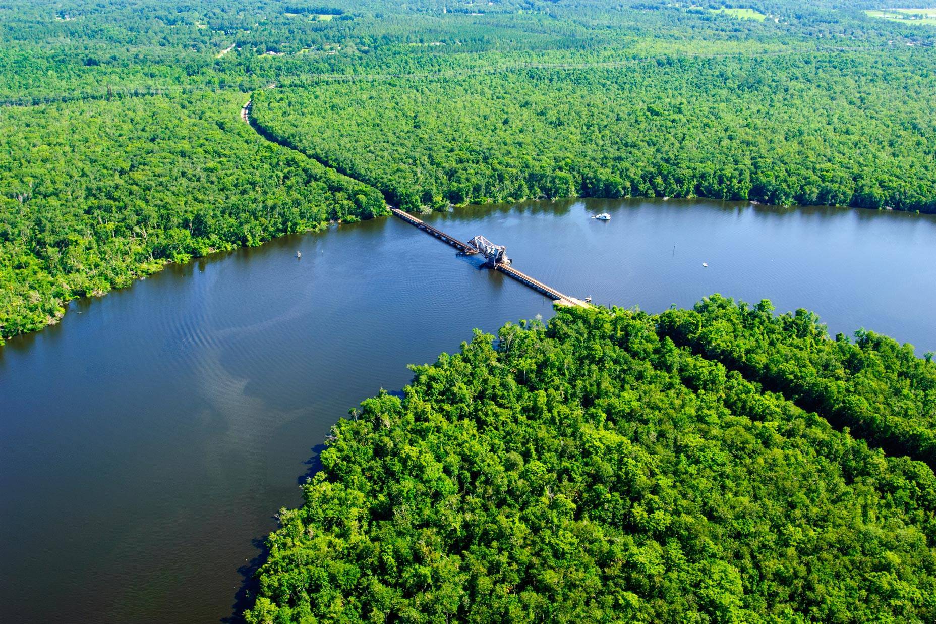 A railway bridge crosses the St. Johns River