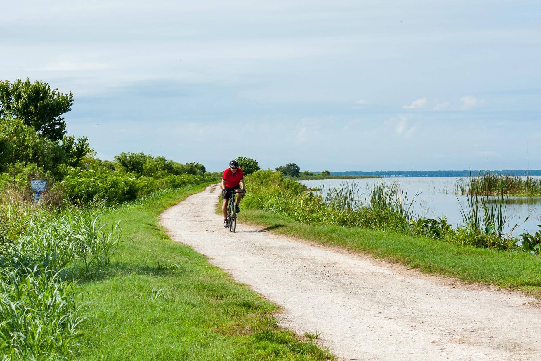 Man riding a bike on a trail