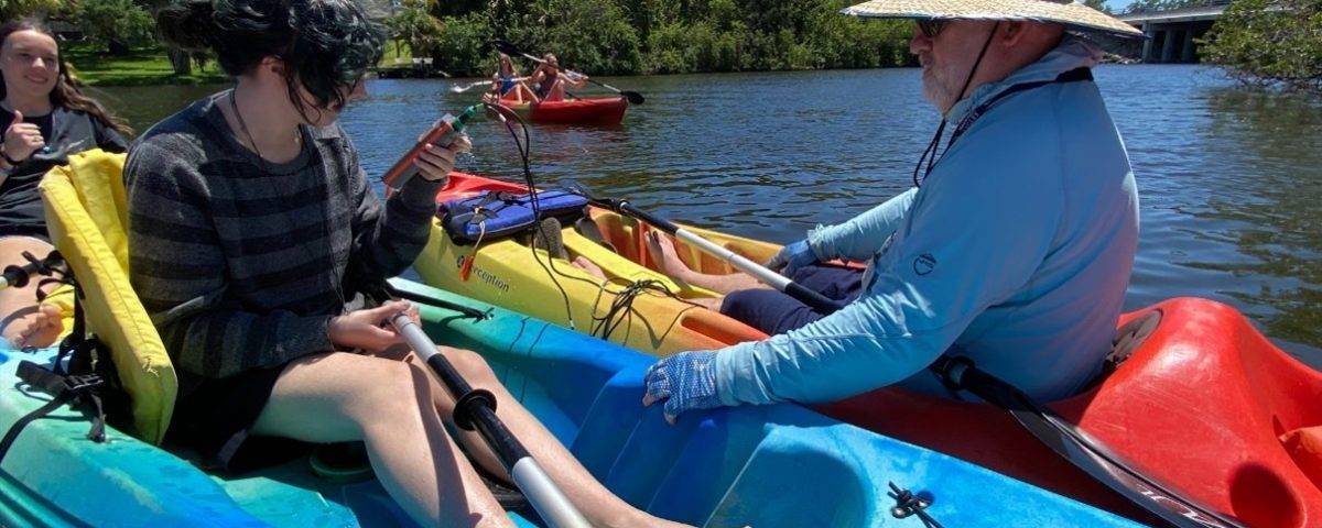 Students and instructors in canoes