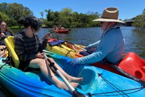 Students and instructors in canoes