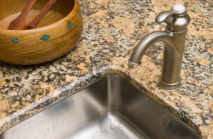 Kitchen faucet with a fixed leak which helps with environmental stewardship