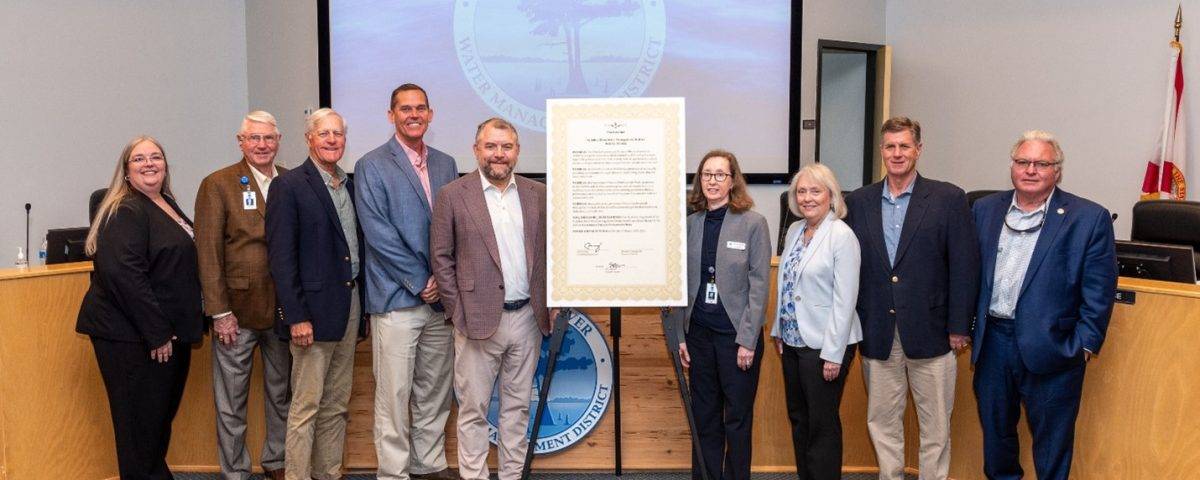 Governing board members pictured next to a proclamation