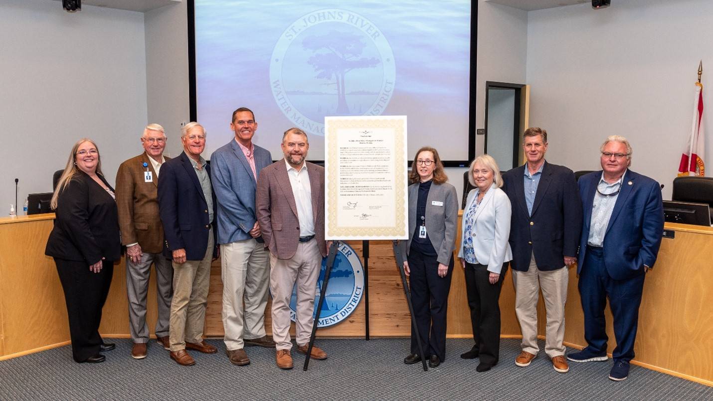 Governing board members pictured next to a proclamation