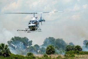 Helicopter igniting a prescribed fire