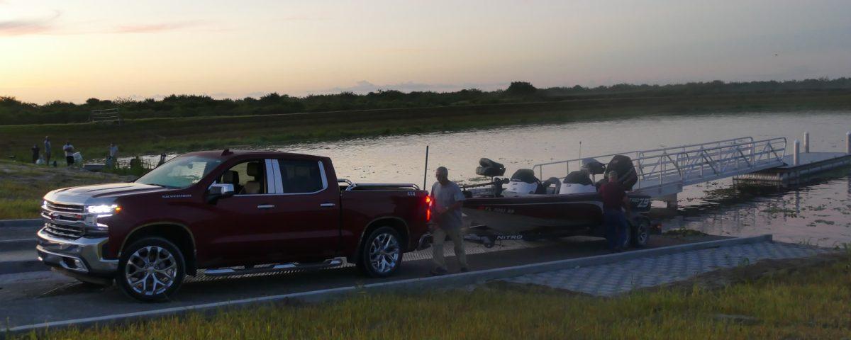 Person getting ready to launch a boat at dawn