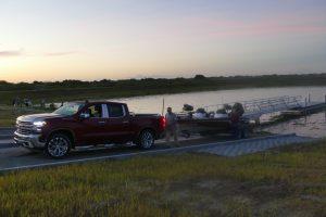 Person getting ready to launch a boat at dawn