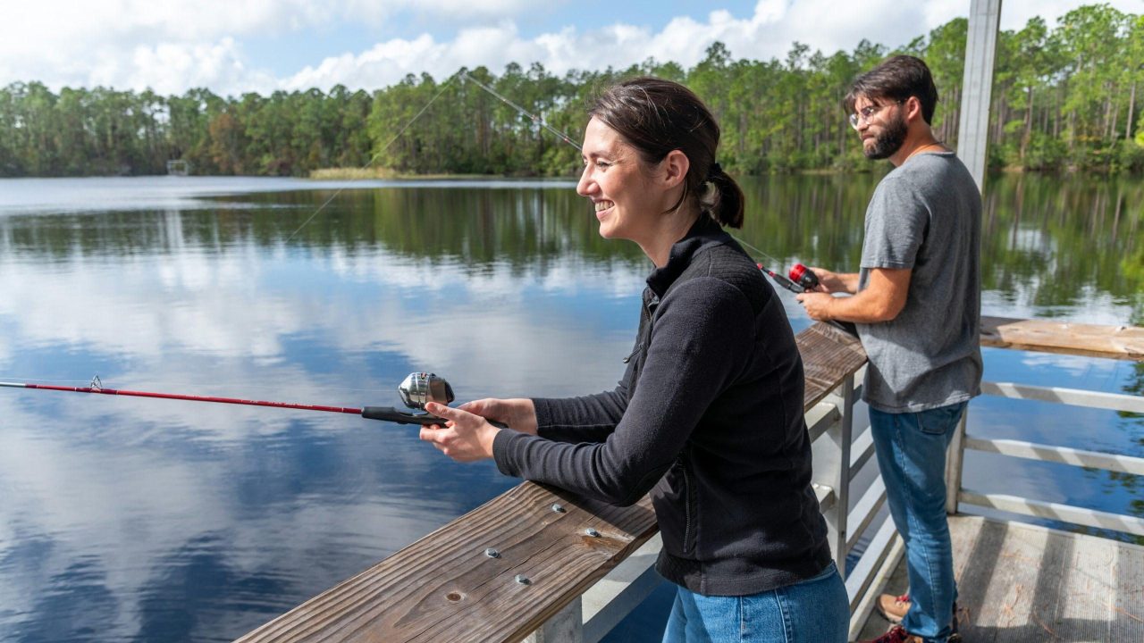 visitor fishing off of dock