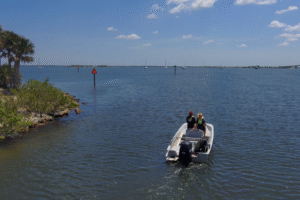 A boater enjoys a calm day on the Indian River Lagoon — a reminder of the vital connection between recreational access and the ongoing efforts to protect the lagoon’s health.