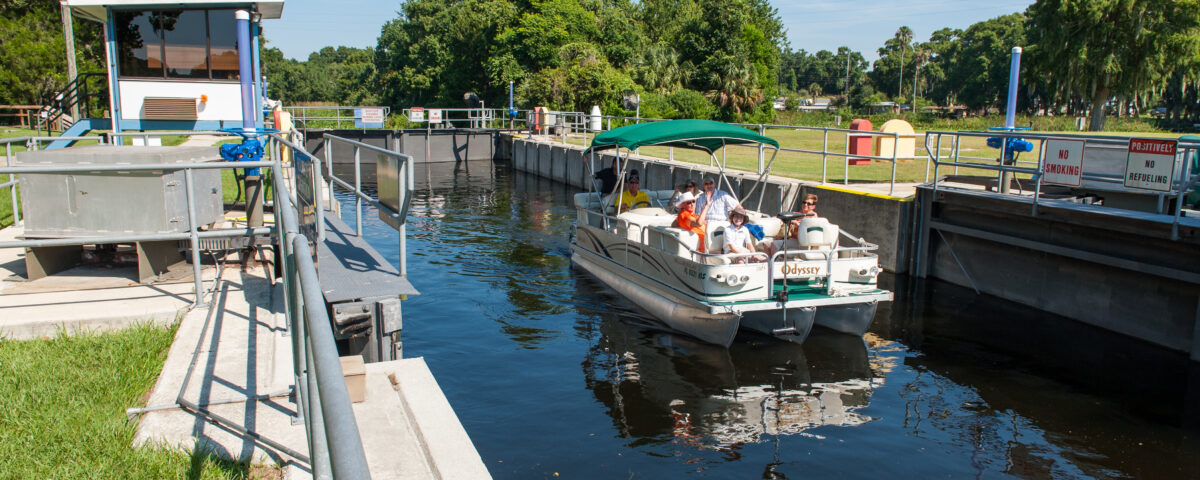 family on a boat using the burrell lock