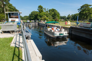 family on a boat using the burrell lock