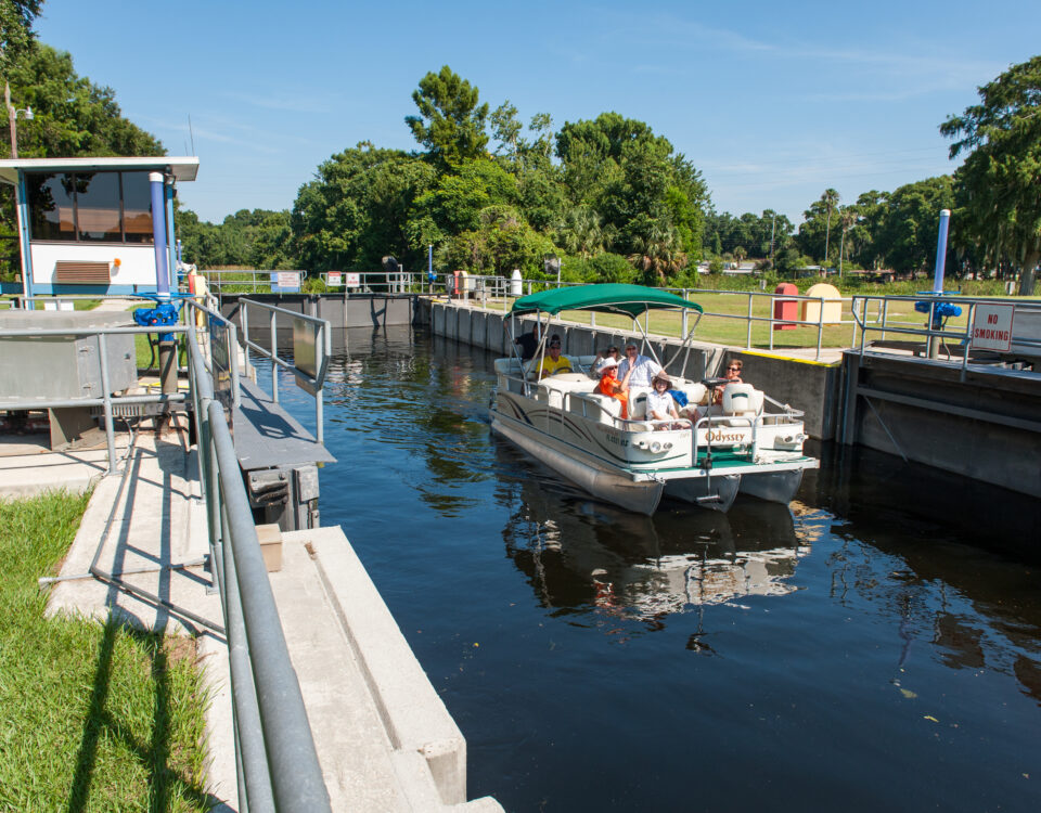 family on a boat using the burrell lock