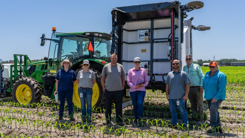 Members of the Districts Agricultural Assistance Team attending a demonstration of high precision crop spraying equipment (Ecorobotix) at Sykes Family Farms in Elkton, FL - In attendance: Suzanne Archer, Wayne Boykin, Corinne Hermle (Strategic Planning Basin Coordinator)