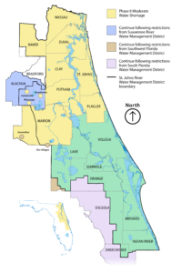 Map of the St. Johns River Water Management District showing counties under a Phase II moderate water shortage in yellow and counties that must continue following neighboring water management districts’ watering restrictions in blue, tan, and purple.