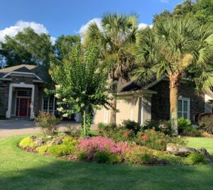 house with floral landscape