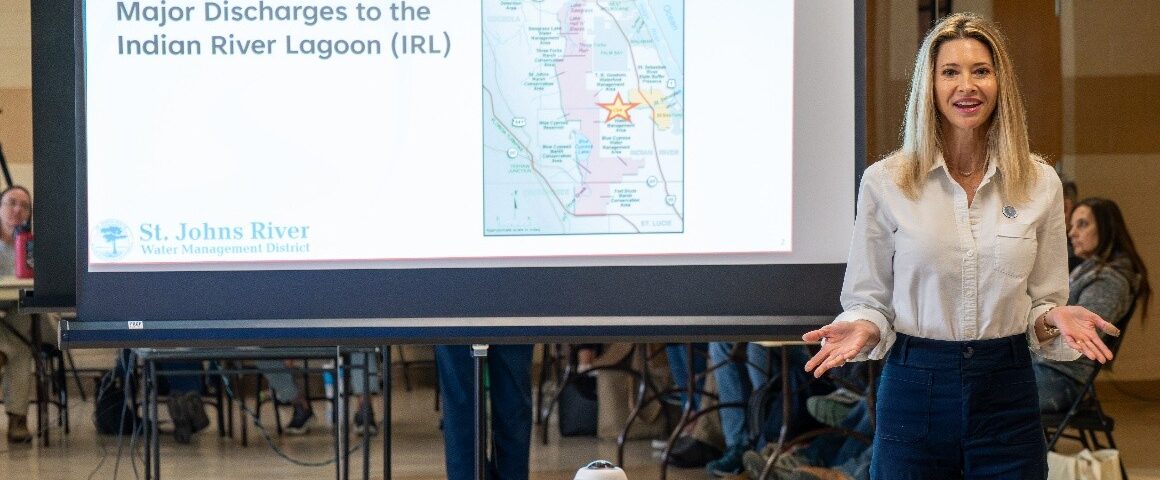 District staff presenting in front of a projector screen