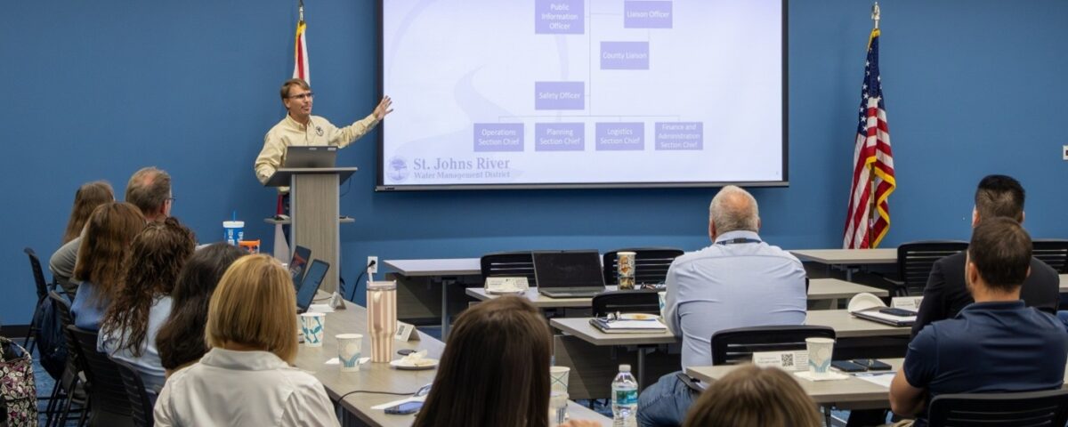 St. Johns River Water Management District Emergency Coordinating Officer Chris Kinslow presents the District Emergency Operations Center organizational chart to staff during a hurricane preparedness training session.