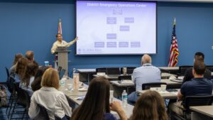 St. Johns River Water Management District Emergency Coordinating Officer Chris Kinslow presents the District Emergency Operations Center organizational chart to staff during a hurricane preparedness training session.