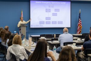 St. Johns River Water Management District Emergency Coordinating Officer Chris Kinslow presents the District Emergency Operations Center organizational chart to staff during a hurricane preparedness training session.