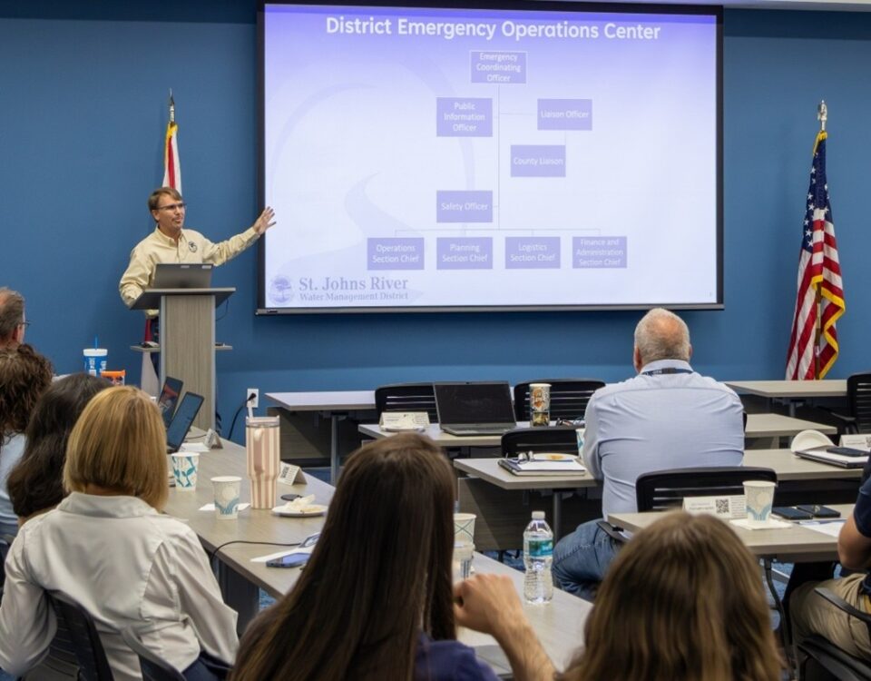 St. Johns River Water Management District Emergency Coordinating Officer Chris Kinslow presents the District Emergency Operations Center organizational chart to staff during a hurricane preparedness training session.