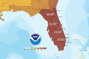 NOAA rainfall map showing estimated storm totals across Florida and the eastern Gulf Coast, with the state shaded in deep red and labeled rainfall amounts from about 30 to 36 inches, plus a color scale bar and NOAA logo indicating extreme precipitation over the peninsula and nearby coastal areas.
