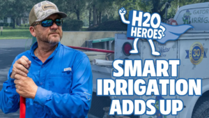 Promotional graphic for H2O Heroes: Smart Irrigation Adds Up, showing a person in a blue work shirt holding a red-handled tool beside an irrigation service truck, with the H2O Heroes logo and campaign title.