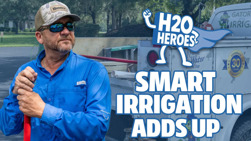 Promotional graphic for H2O Heroes: Smart Irrigation Adds Up, showing a person in a blue work shirt holding a red-handled tool beside an irrigation service truck, with the H2O Heroes logo and campaign title.