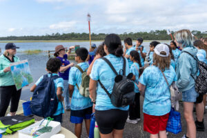 Sanford Middle School students learn about water quality monitoring and one of the eight stations set up for Tide Fest, a school and community celebration of estuaries held at the Guana Tolomato Matanzas National Estuarine Research Reserve.