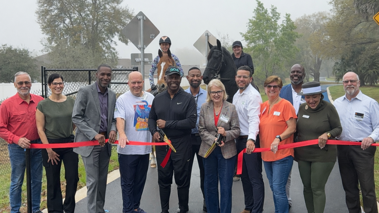 Orange County officials holding a ribbon cutting ceremony opening the Lake Apopka Connector Trail