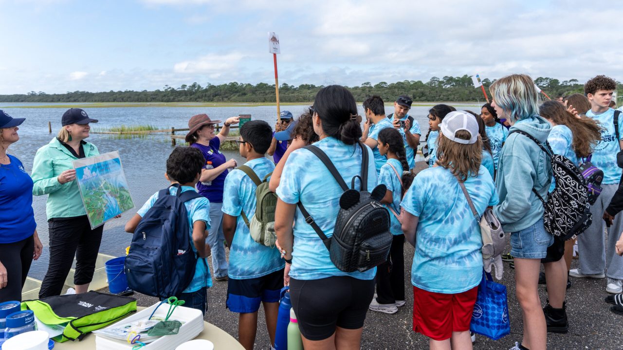 Sanford Middle School students learn about water quality monitoring and one of the eight stations set up for Tide Fest, a school and community celebration of estuaries held at the Guana Tolomato Matanzas National Estuarine Research Reserve.