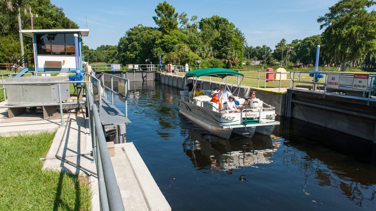 family on a boat using the burrell lock
