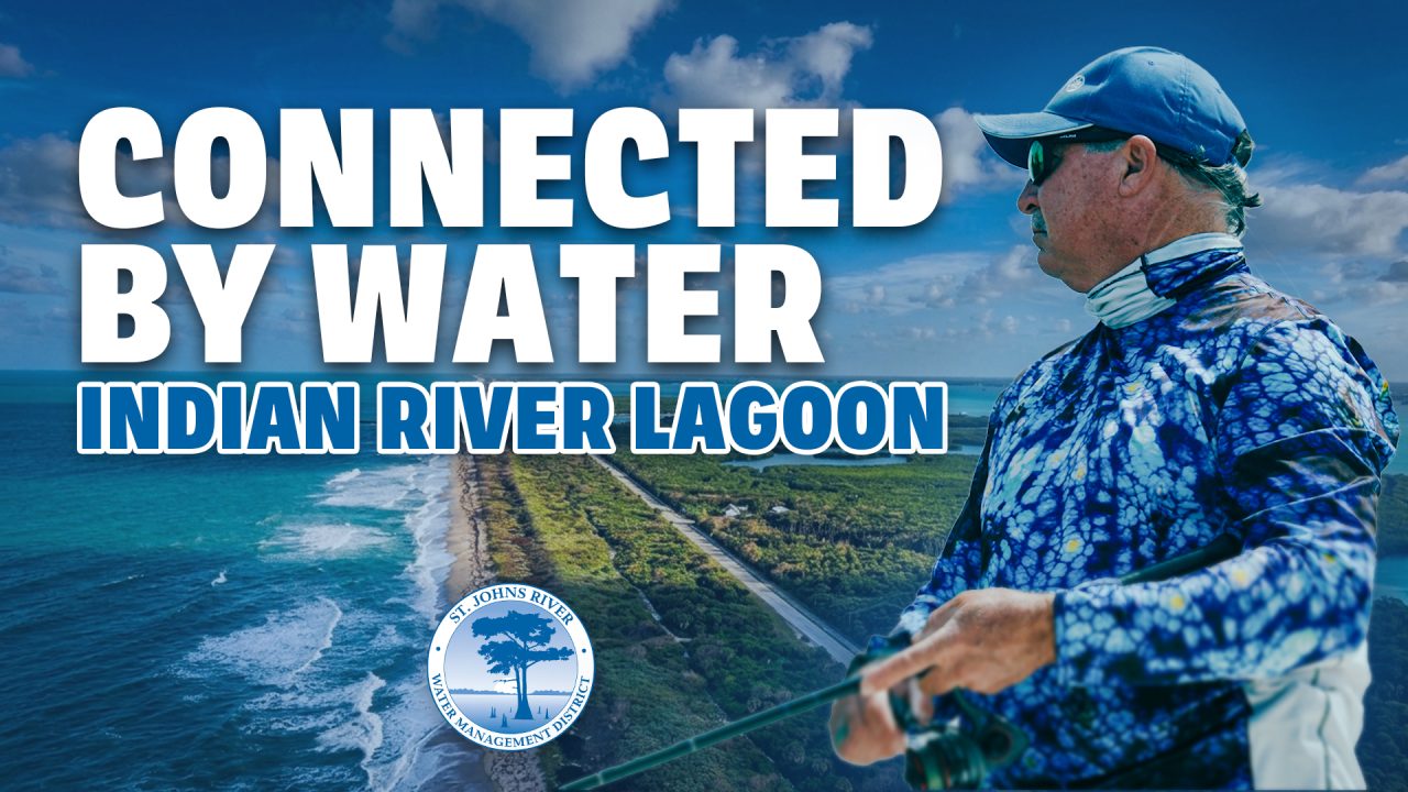 Promotional banner for the St. Johns River Water Management District showing an aerial view of the Indian River Lagoon shoreline and a man in fishing gear, with large text reading ‘Connected by Water – Indian River Lagoon.’