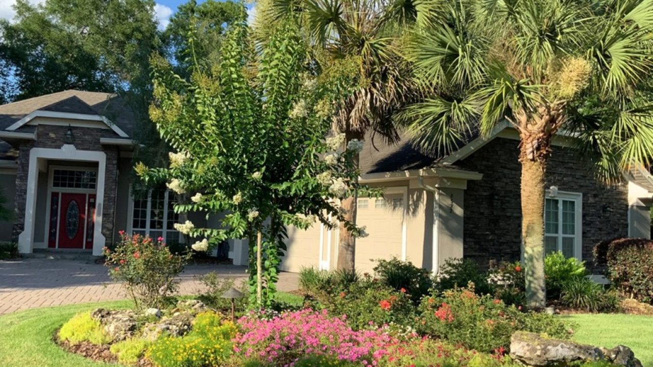 house with floral landscape