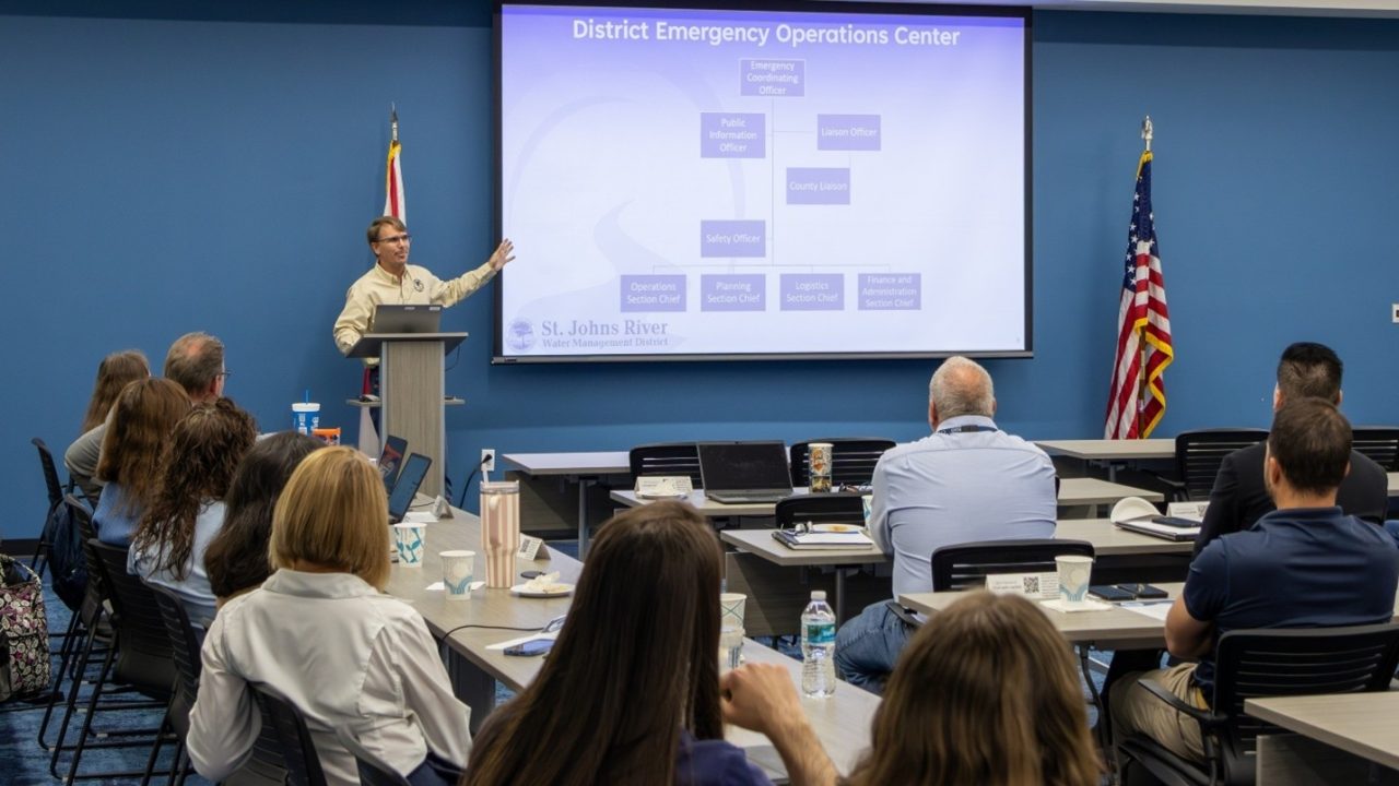 St. Johns River Water Management District Emergency Coordinating Officer Chris Kinslow presents the District Emergency Operations Center organizational chart to staff during a hurricane preparedness training session.